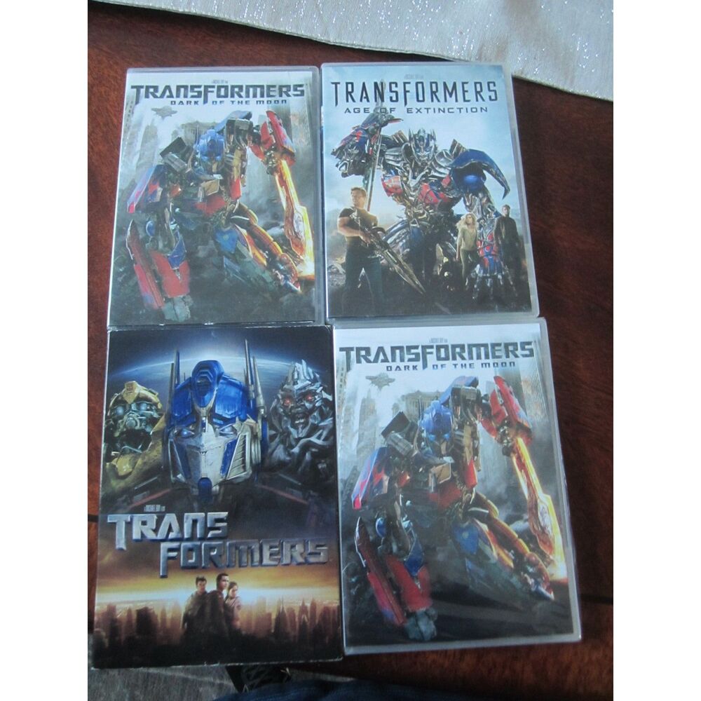 LOT OF 4 TRANSFORMERS DVDS AGE OF EXTINCTION. DARK OF THE MOON X2, AND MORE